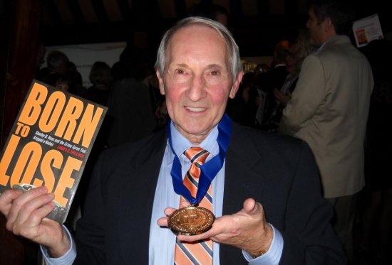 Marshall alum receives national recognition for award-winning true crime book Jim Hollock smiles after receiving the gold medal for true crime by the 2012 Independent Publisher Book Awards for his book Born To Lose: Stanley B. Hoss and the Crime Spree That Gripped a Nation.